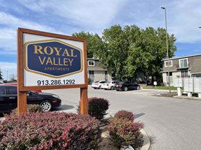 Blue Springs apartment for rent - A sign for Royal Valley Apartments with a phone number on it.