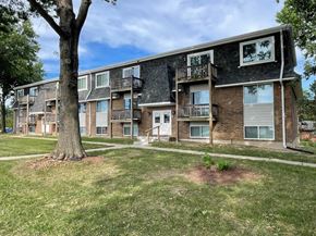 Blue Springs apartment for rent - A large tree is in front of apartment buildings.