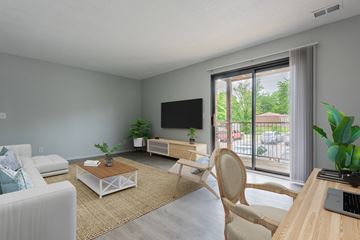 Lee's Summit apartment for rent - a living room with a couch and a table and a television