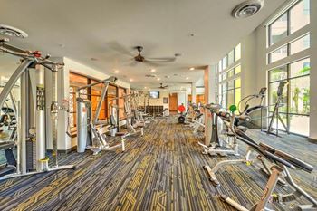 A room filled with lots of different types of exercise equipment
