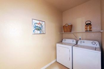 A white washer and dryer in a room