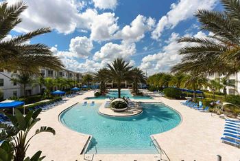 A large pool with a fountain in the middle of it