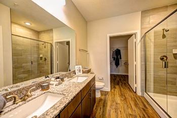 A bathroom with a sink toilet and shower