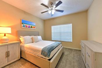 Spacious bedrooms with a ceiling fan