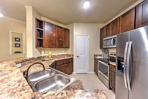 Jacksonville apartment for rent - A kitchen with a granite counter top and stainless steel appliances at Cabana Club - Galleria Club Apartments, Jacksonville, FL, 32256