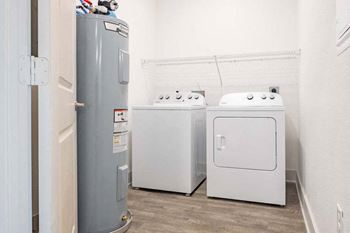 A room with a washer and dryer in it
