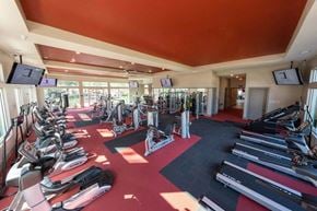 Jacksonville apartment for rent - a room filled with lots of different types of exercise equipment  at Luxor Club, Jacksonville, 32258