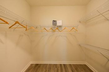 A walk in closet in a bedroom