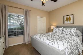 Jacksonville Beach apartment for rent - a bedroom with a bed next to a window  at Ocean Park, Florida