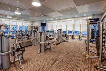 A room filled with lots of different types of exercise equipment