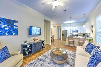 A living room with a couch and a table