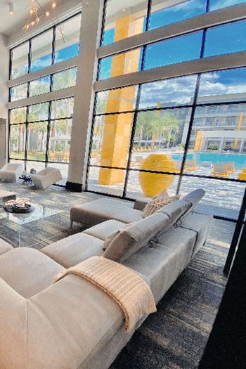 A living room filled with furniture and a large window