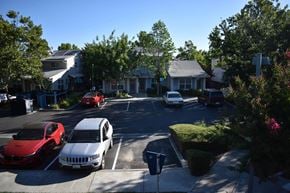 Davis townhouse for rent - A residential street with cars parked on both sides.