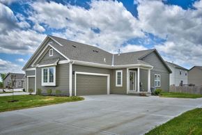 Gardner triplex for rent - a house with a driveway and a garage door
