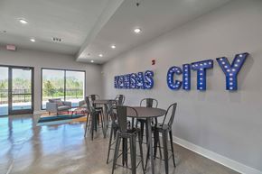 Olathe apartment for rent - a dining room with a table and chairs in front of a window