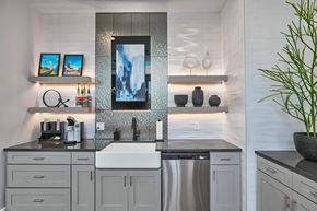 Olathe apartment for rent - a white kitchen with stainless steel appliances and a sink