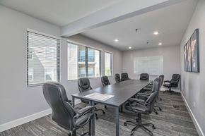 Olathe apartment for rent - a conference room with a long table and chairs