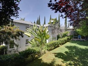 Los Angeles apartment for rent - a white house with a yard and a garden