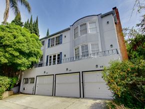 Los Angeles apartment for rent - a white house with a garage door in front of it