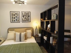 Yakima apartment for rent - a bedroom with a bed and pictures on the wall