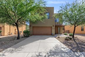 Sierra Vista apartment for rent - A modern house with a brown garage door and a driveway.