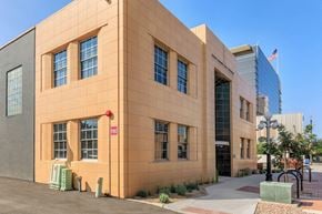 Tucson apartment for rent - A building with a red sign on the left side of it.