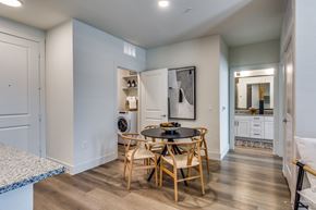 Midlothian apartment for rent - a dining room with a table and chairs and a laundry room