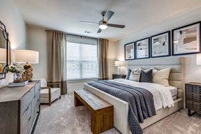 Midlothian apartment for rent - a bedroom with a large bed and a ceiling fan