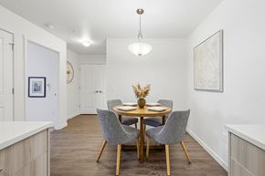 Richland apartment for rent - A dining room with a round table and grey chairs.
