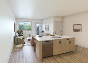 Lacey apartment for rent - A kitchen with a sink, a window, and a dining table.