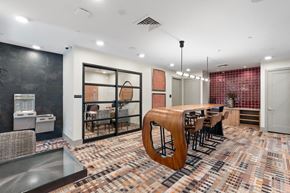 Flagstaff apartment for rent - a dining room with a long wooden table and chairs