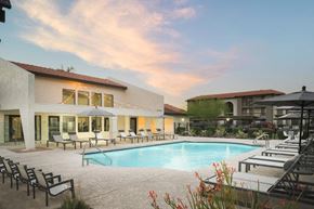 Phoenix apartment for rent - a swimming pool at a resort with chairs and umbrellas