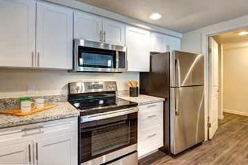 Bellevue apartment for rent - a kitchen with stainless steel appliances and white cabinets