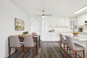 Huntington Beach apartment for rent - A kitchen with a dining table and chairs.
