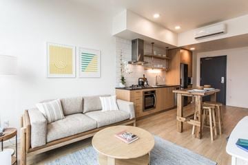 Portland apartment for rent - a living room and kitchen with a couch and a table