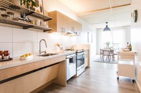 Portland apartment for rent - a kitchen with a sink and a stove and a table