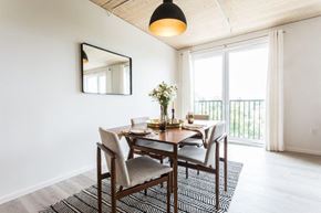 Portland apartment for rent - a dining room with a wooden table and chairs