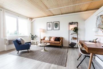 Portland apartment for rent - a living room with a couch and a chair and a desk