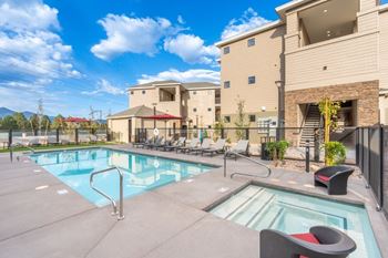 Resort-style swimming pool with spa grill area
