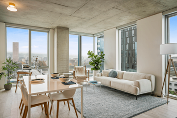 Portland apartment for rent - A modern living room with a dining table and chairs.