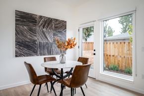 Gresham apartment for rent - The Wes Gresham Oregon Apartments  Dining area with 4 chairs, table and flowers