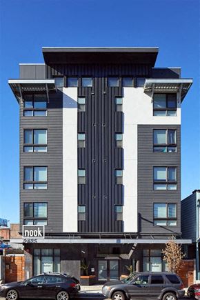 Oakland apartment for rent - a tall building with a black and white facade
