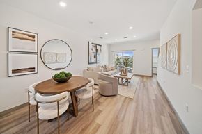 Denver apartment for rent - A modern dining room with a round table and chairs.