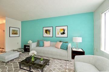 Vancouver apartment for rent - a living room with a couch and a turquoise wall