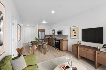 Beaverton apartment for rent - A modern living room with a green couch and a television.
