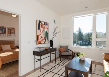 Gresham apartment for rent - A living room with a sofa, a table, and a painting on the wall.