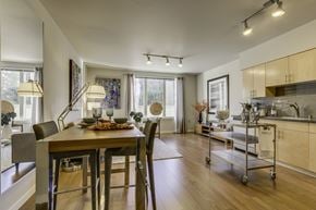 Seattle apartment for rent - A modern dining room with a wooden table and chairs.