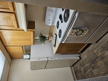Kent apartment for rent - an overhead view of a kitchen with a stove and a refrigerator