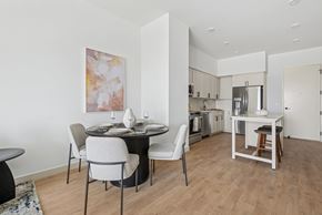 Salt Lake City apartment for rent - A modern dining room with a round table and chairs.