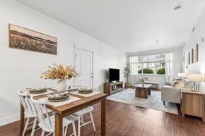 Richland apartment for rent - A dining room with a wooden table and white chairs.